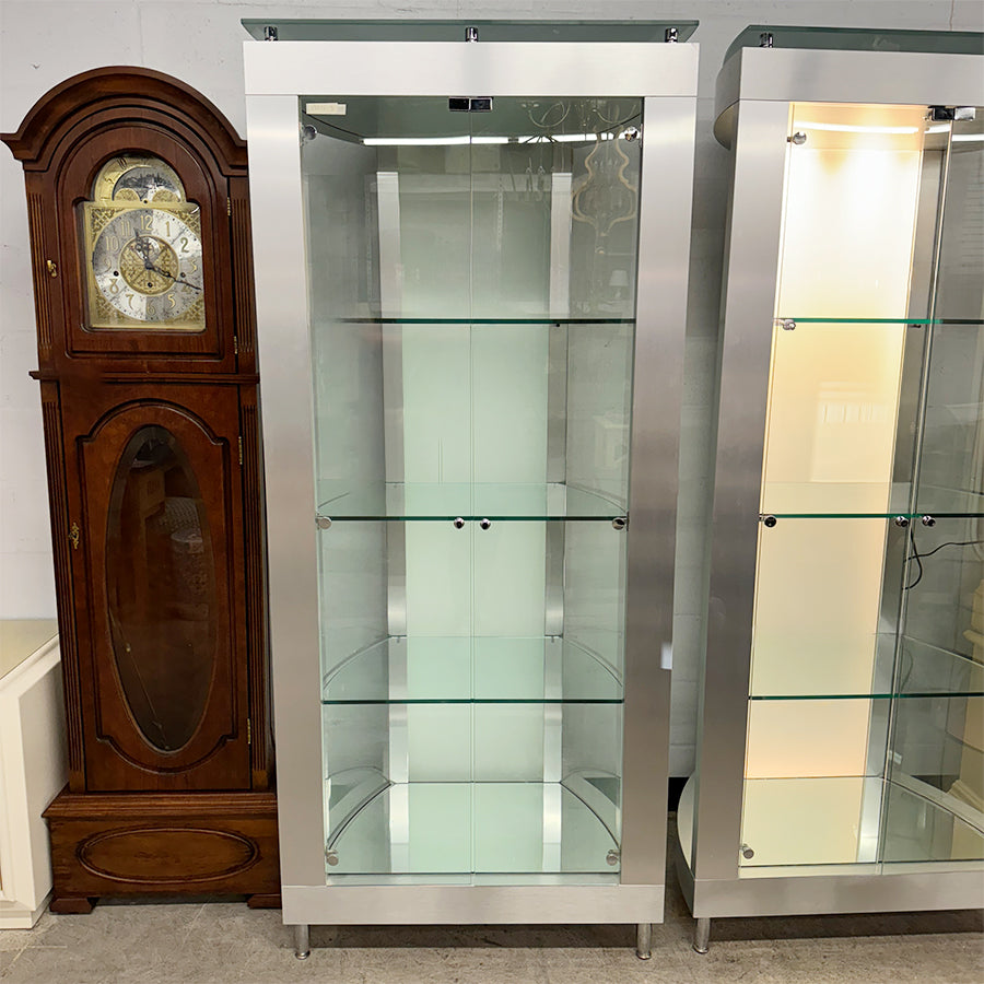 Curio cabinet- stainless , 3 glass shelves, back lights up.