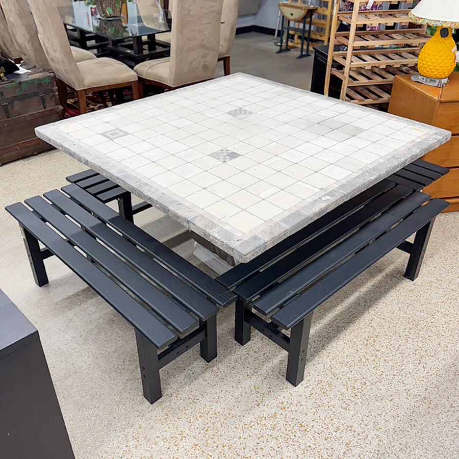 Patio table- cream, gray tile top w/ 4 black benches.