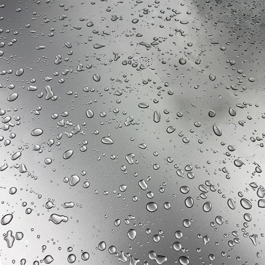Dining table- glass w/ water droplets, 6 white leather chairs