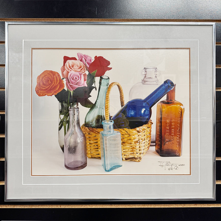 Still life with bottles and flowers color photography
