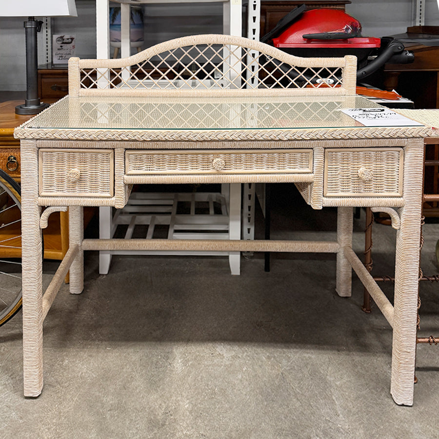 Desk- beige wicker, w/ glass top. 3 drawer
