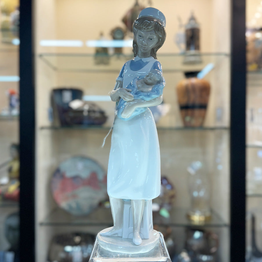 Nao 'Nurse Holding Baby' Figurine